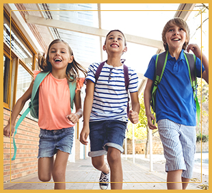 Three students running outside